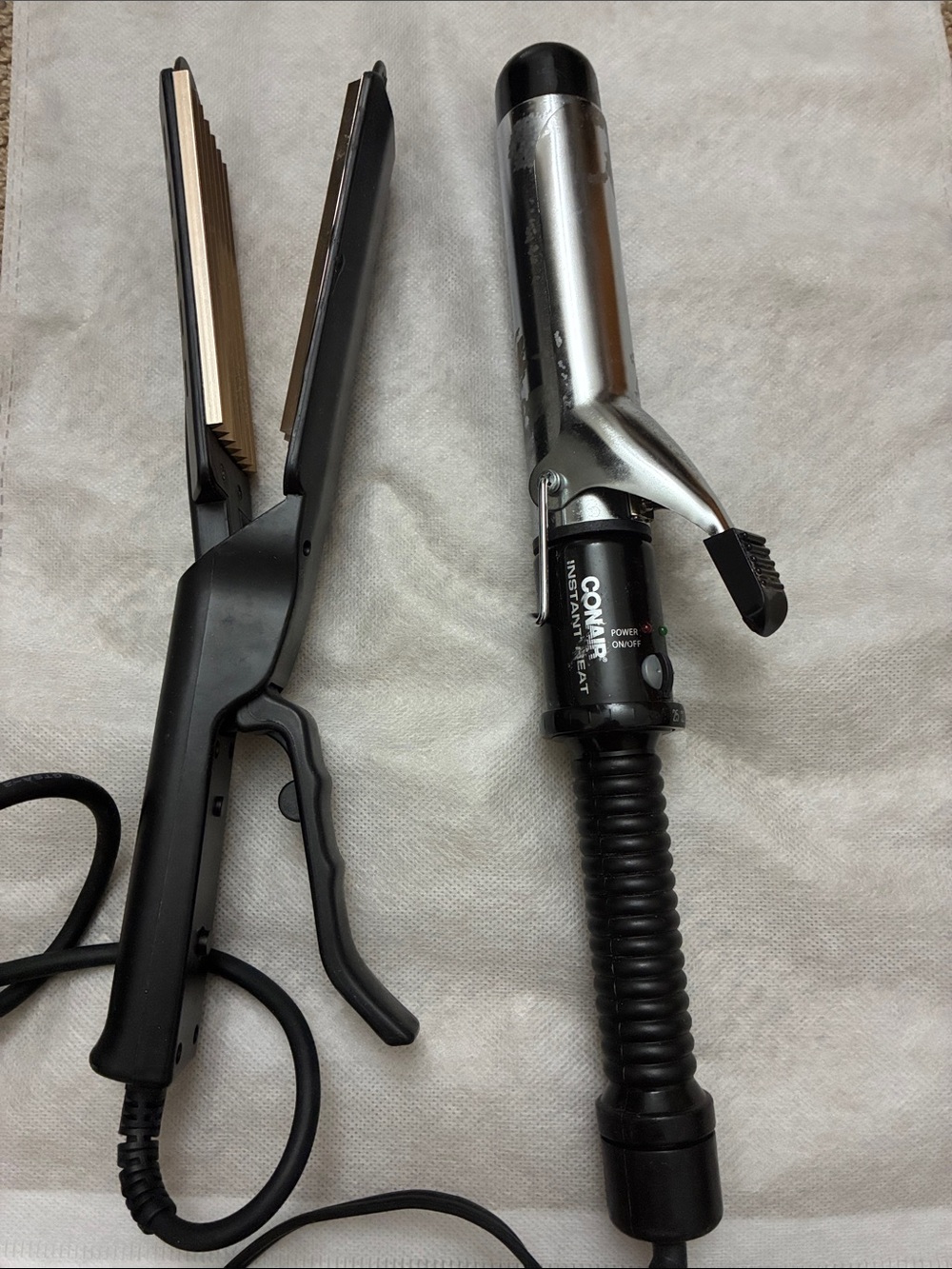 Hair styling tools set includes a crimper iron and a curling iron
